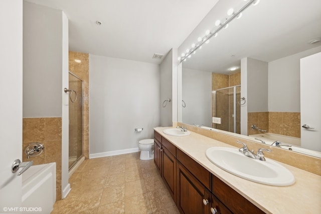 full bathroom with toilet, tile patterned flooring, vanity, and shower with separate bathtub