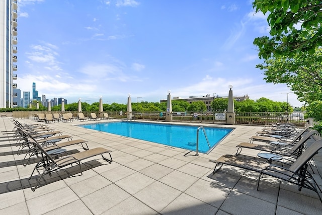 view of swimming pool featuring a patio