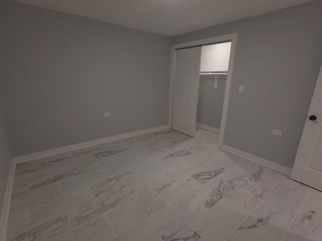 unfurnished bedroom featuring a closet