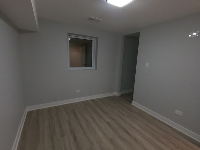 empty room with wood-type flooring