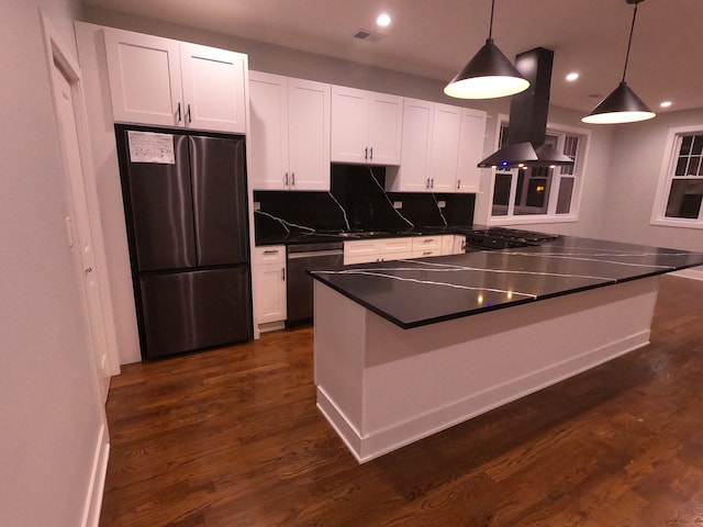 kitchen featuring white cabinets, pendant lighting, stainless steel appliances, and island range hood