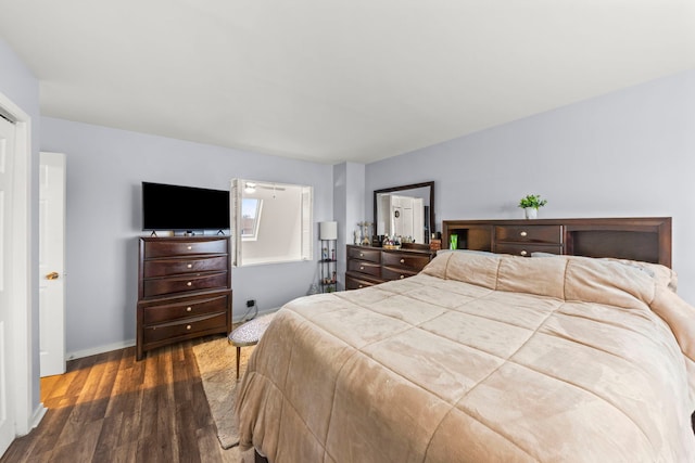 bedroom with dark wood-type flooring