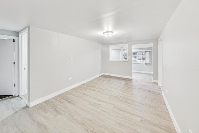 spare room featuring light hardwood / wood-style flooring