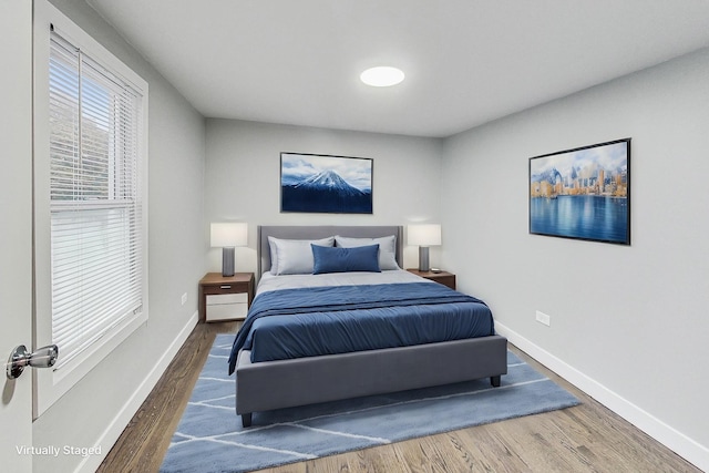 bedroom with hardwood / wood-style floors