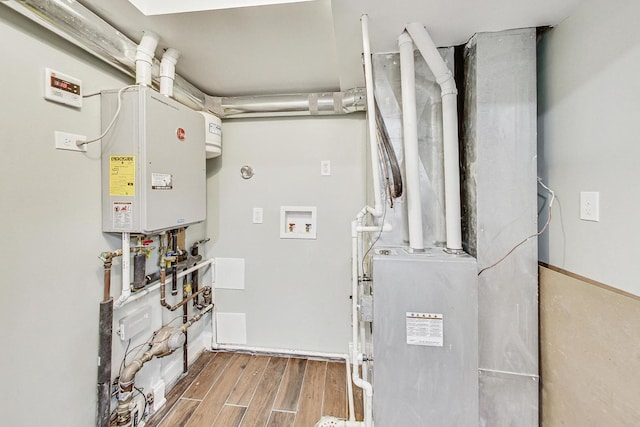 utility room featuring water heater