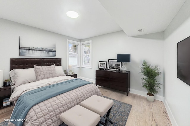 bedroom with light hardwood / wood-style flooring