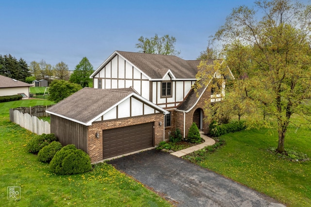 english style home with a front yard