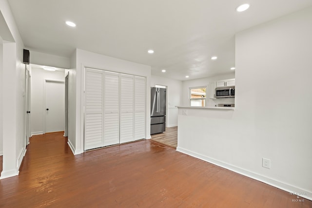 unfurnished living room with light wood-type flooring