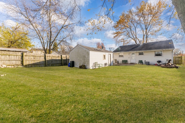 rear view of house with a yard