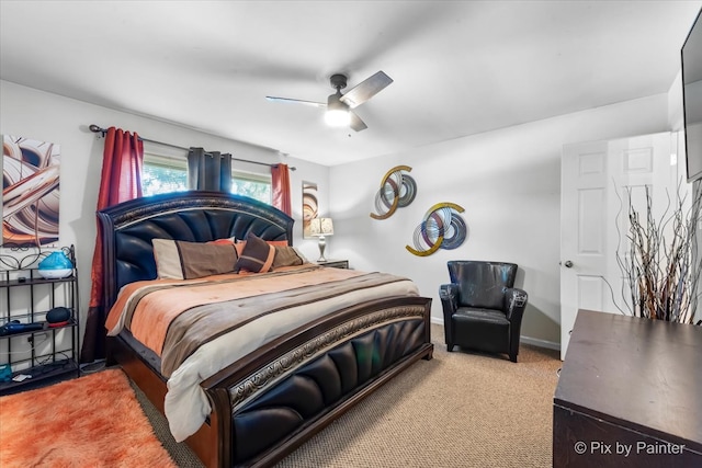 bedroom with light colored carpet and ceiling fan