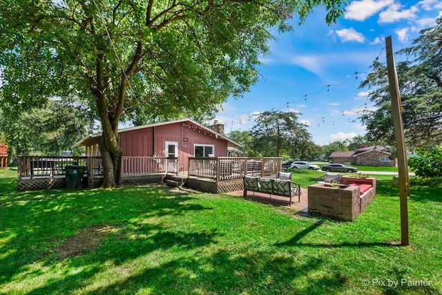 view of yard featuring outdoor lounge area and a wooden deck