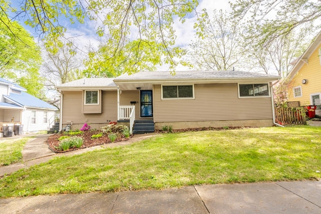 615 W Union St, Champaign, IL 61820 - view of front of house with a front yard and a shingled roof