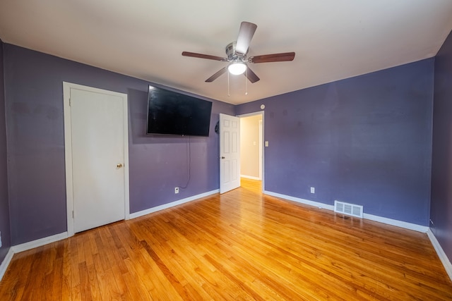 unfurnished bedroom featuring ceiling fan and light hardwood / wood-style flooring