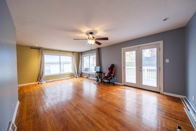 spare room featuring ceiling fan, french doors, and light hardwood / wood-style floors