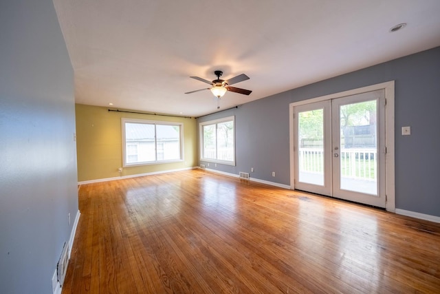 615 W Union St, Champaign, IL 61820 - spare room with wood finished floors, baseboards, french doors, and a ceiling fan