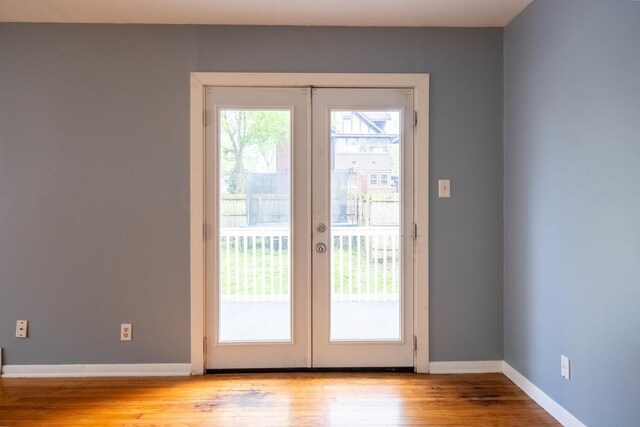 615 W Union St, Champaign, IL 61820 - unfurnished living room featuring baseboards, a ceiling fan, visible vents, and light wood-style floors