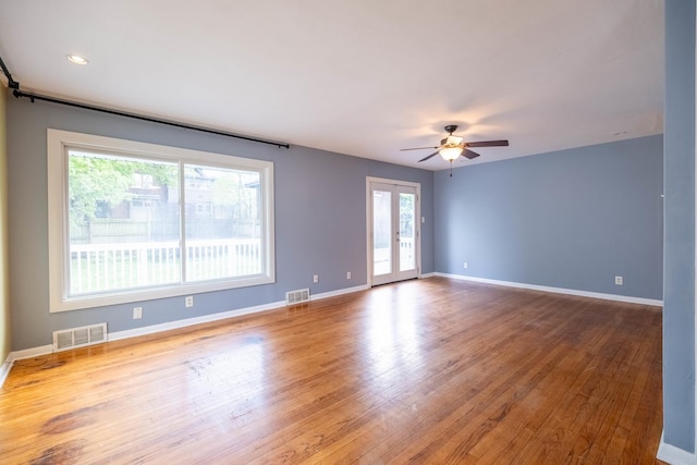 615 W Union St, Champaign, IL 61820 - interior space with a ceiling fan, baseboards, wood-type flooring, and visible vents