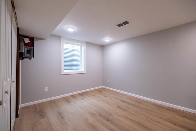 615 W Union St, Champaign, IL 61820 - finished below grade area with light wood-type flooring, baseboards, and visible vents