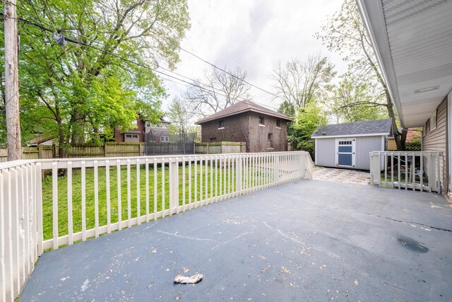 615 W Union St, Champaign, IL 61820 - below grade area with freestanding refrigerator, bar area, concrete block wall, and wood finished floors