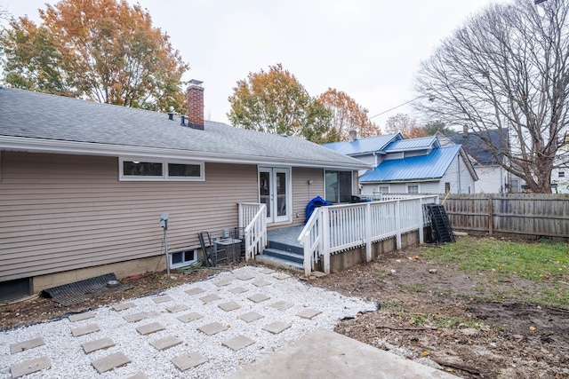 back of property featuring central air condition unit, french doors, and a deck