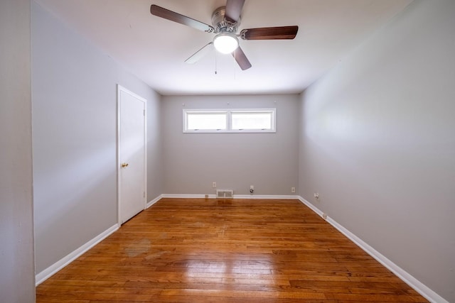 615 W Union St, Champaign, IL 61820 - unfurnished room with ceiling fan, visible vents, baseboards, and hardwood / wood-style floors