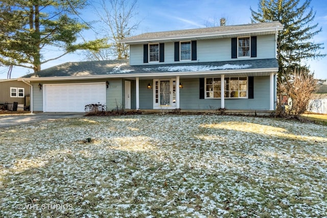 view of front of house with covered porch and a garage