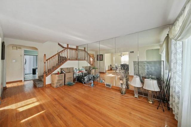 unfurnished living room with wood-type flooring