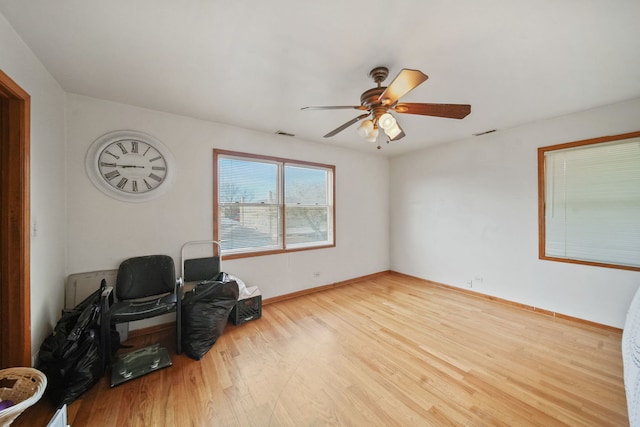 sitting room featuring light hardwood / wood-style flooring and ceiling fan