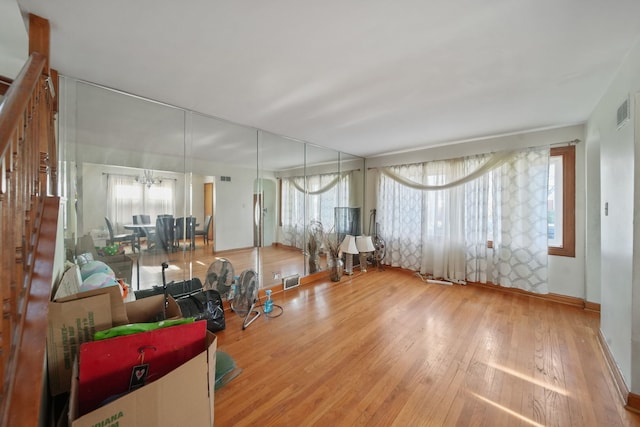 living room featuring a chandelier and hardwood / wood-style flooring