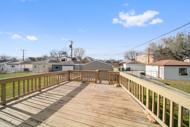 wooden deck featuring a yard