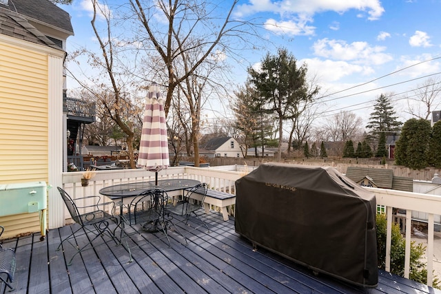 wooden deck featuring area for grilling