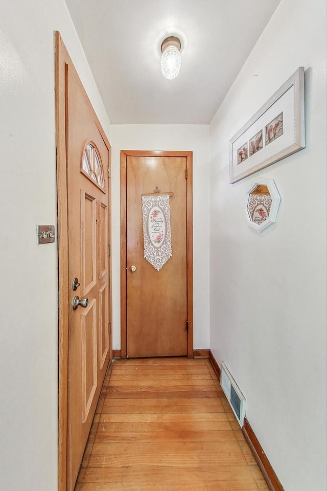 entryway with light hardwood / wood-style flooring