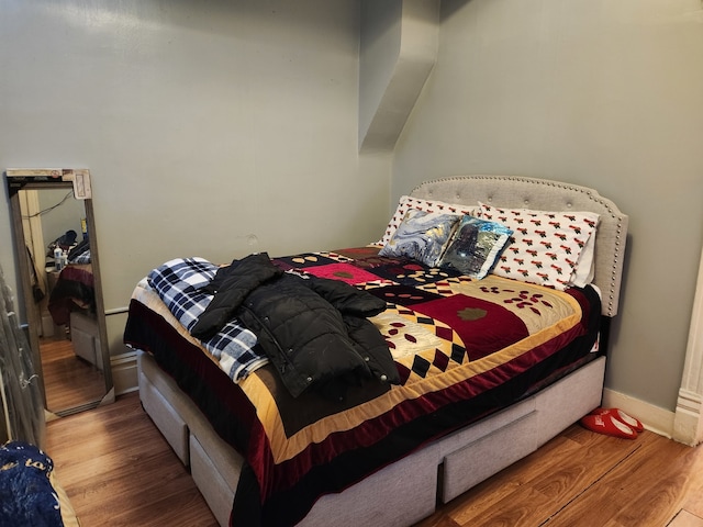 bedroom featuring hardwood / wood-style floors