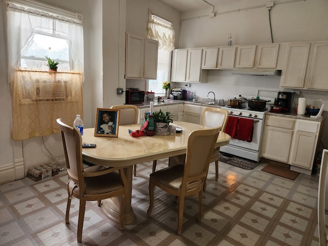 kitchen with cooling unit and white range with gas stovetop