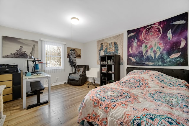 bedroom with hardwood / wood-style flooring