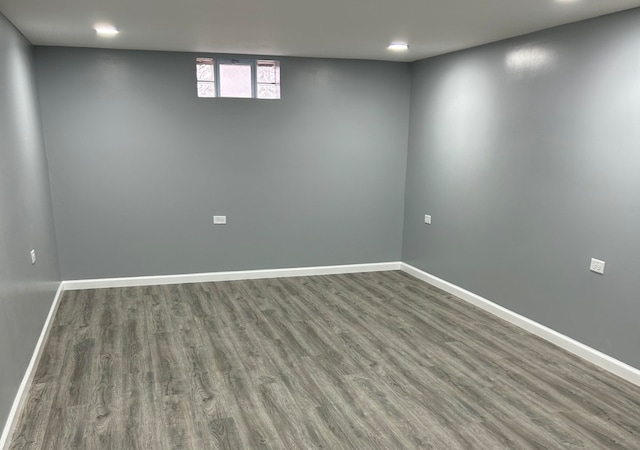 basement with hardwood / wood-style floors