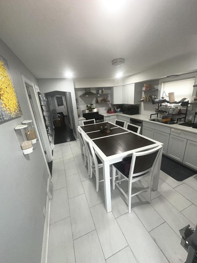 dining space with light tile patterned floors