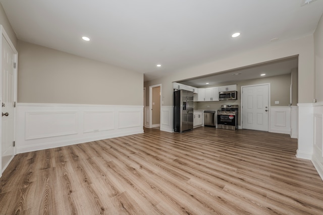 unfurnished living room with light wood-type flooring