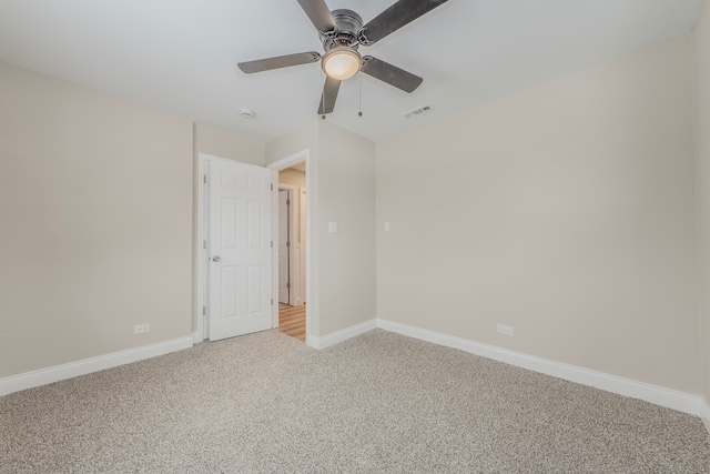 empty room featuring carpet and ceiling fan