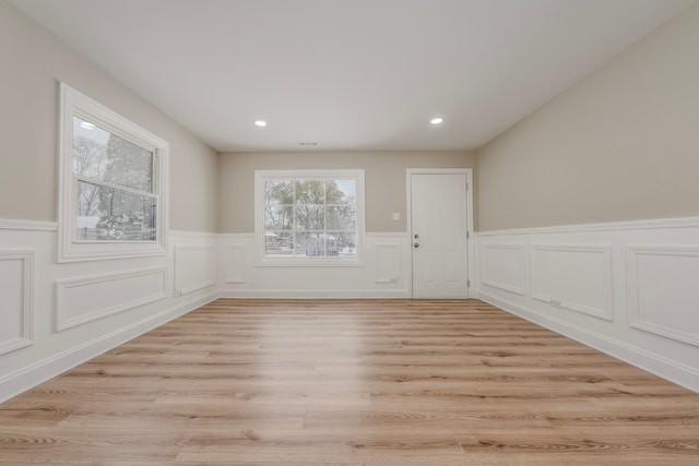 spare room with light hardwood / wood-style floors