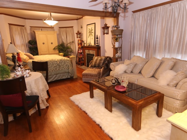 living room featuring hardwood / wood-style flooring and a notable chandelier