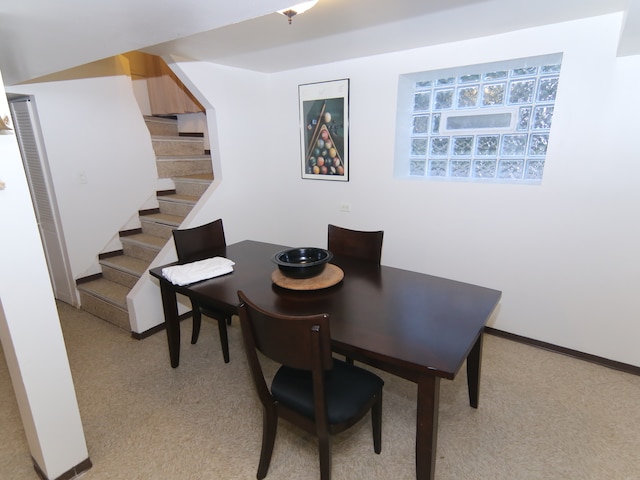 view of carpeted dining space