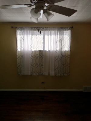 unfurnished room with wood-type flooring