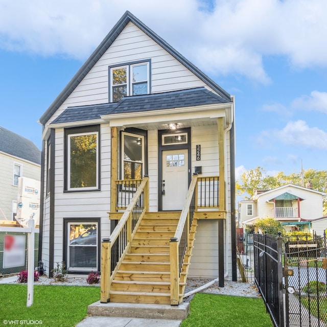 view of front of home featuring a porch and a front lawn