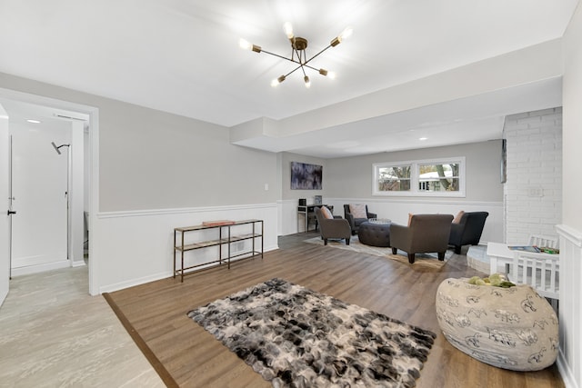 living room featuring hardwood / wood-style floors and an inviting chandelier