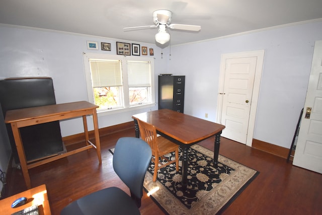 home office with dark hardwood / wood-style flooring, ceiling fan, and ornamental molding