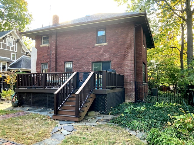 rear view of property with a wooden deck