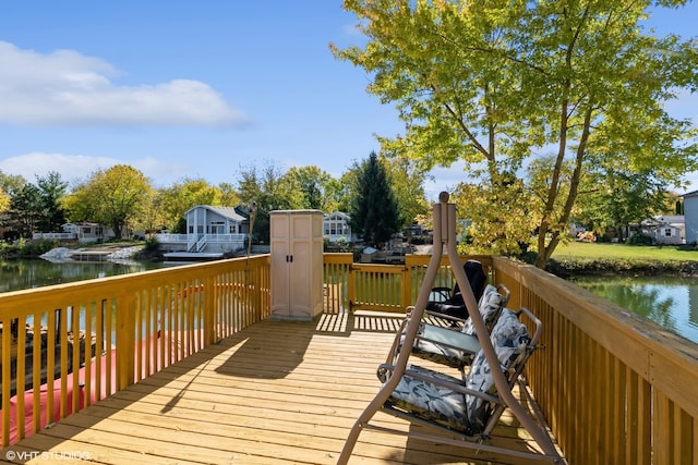 wooden deck with a water view