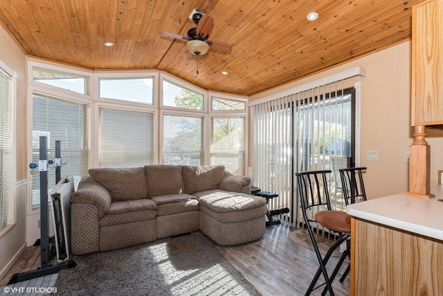 living room featuring ceiling fan, hardwood / wood-style floors, wood ceiling, and lofted ceiling