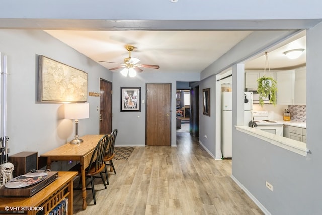 office area featuring ceiling fan and light wood-type flooring